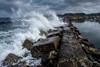 firefly_-concrete-breakwater-absorbing-a-large-wave_sp-852