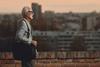 older-adult-walking-along-a-brick-wall-hero