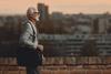older-adult-walking-along-a-brick-wall-hero